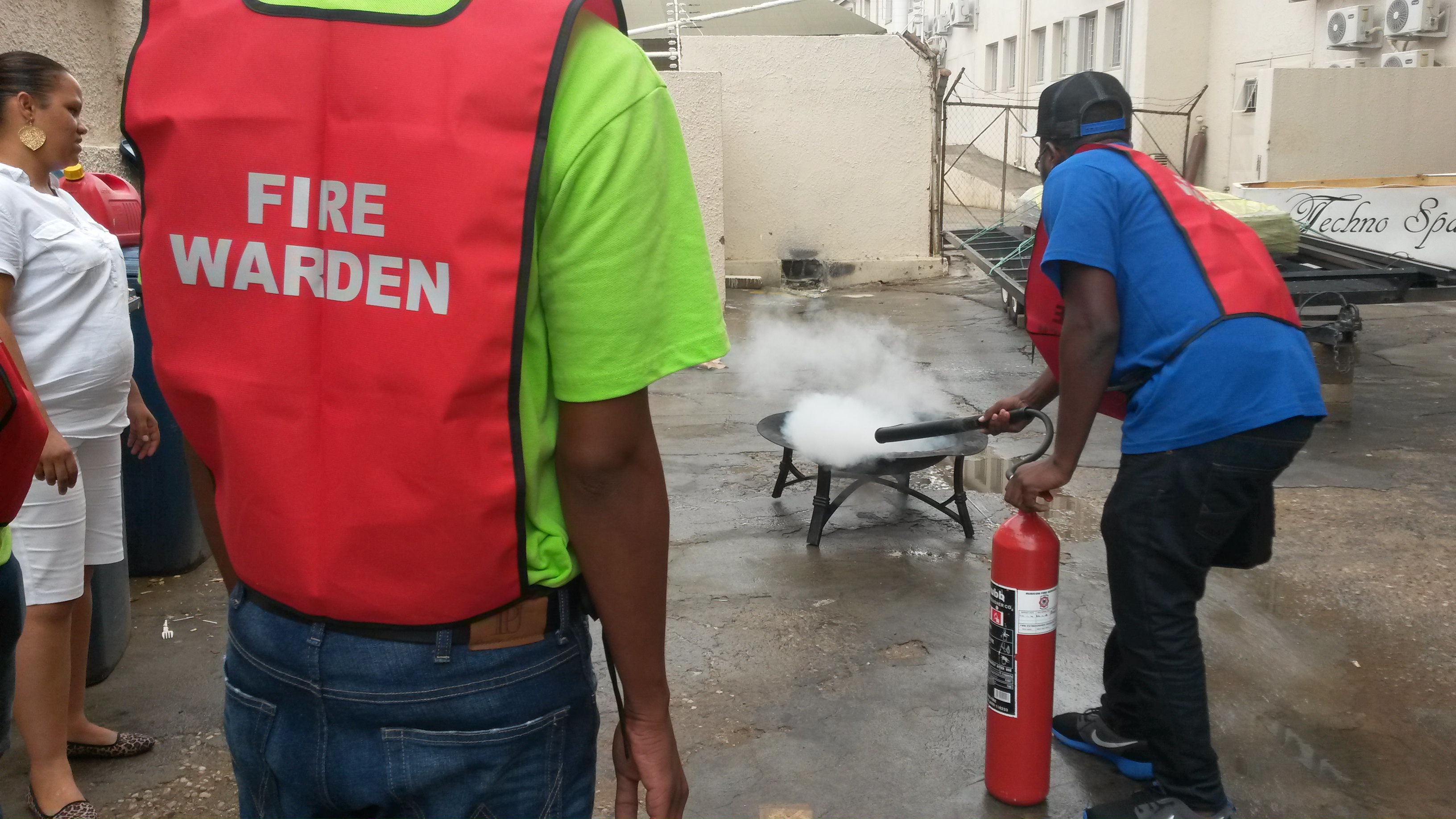 Participants practising industrial fire response